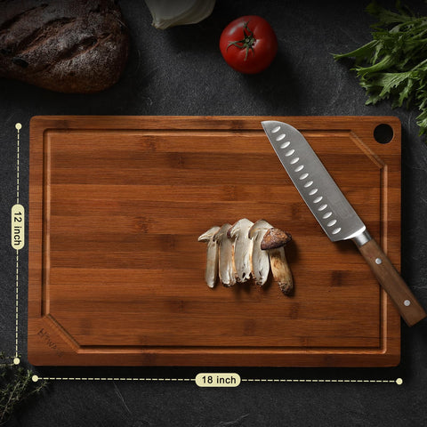 Hiware bamboo cutting board with juice groove catches liquids during chopping.
