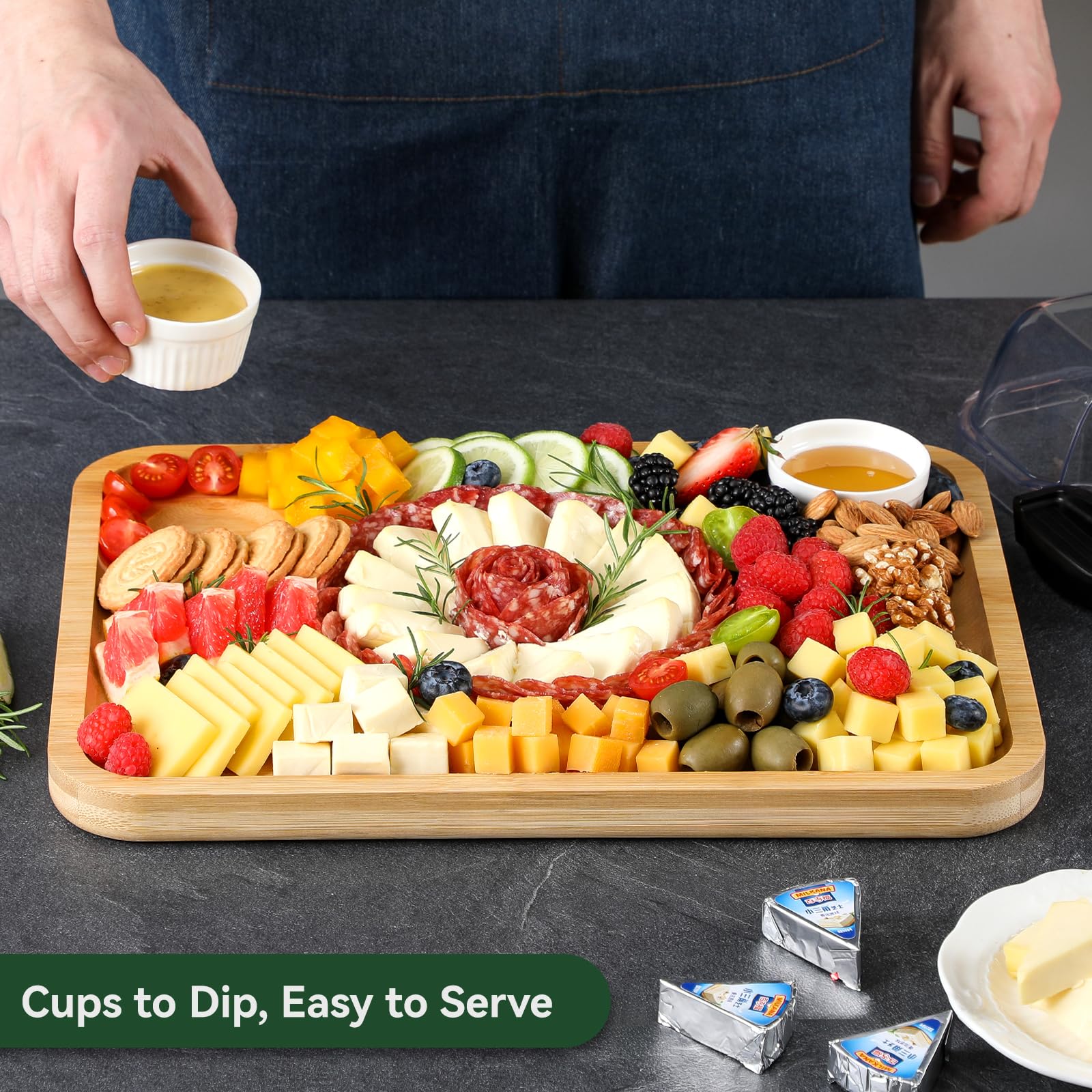 HIWARE charcuterie board includes two dip cups for sauces and dips.