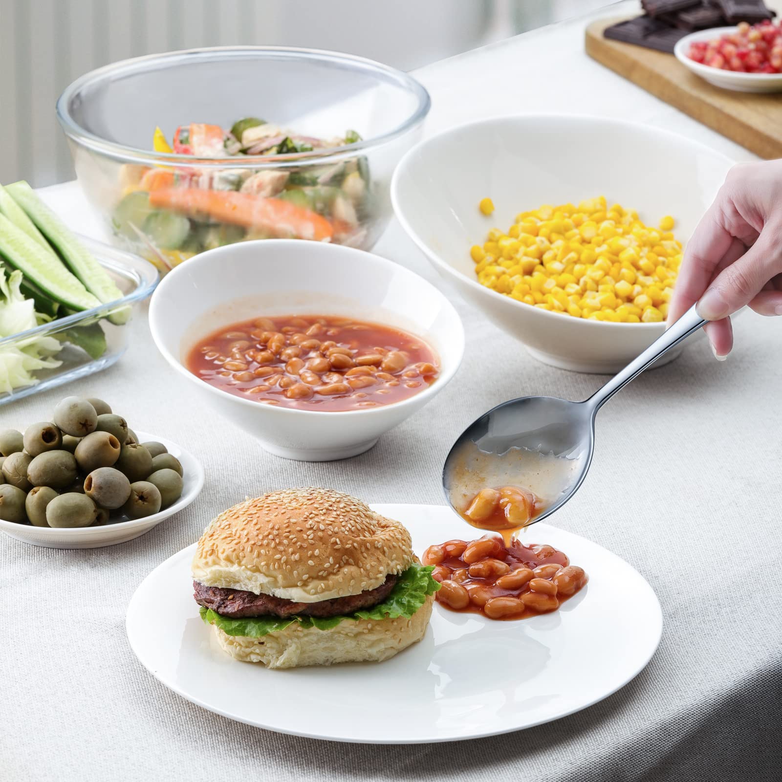 Mirror-polished Hiware serving spoons enhance elegant table presentation.