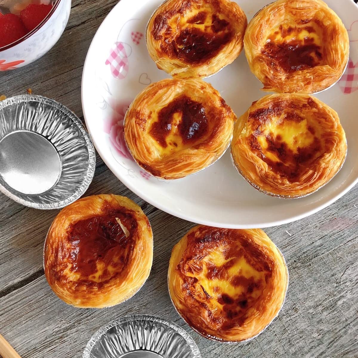 HLCM egg tart molds in use at a party setting for celebrations.