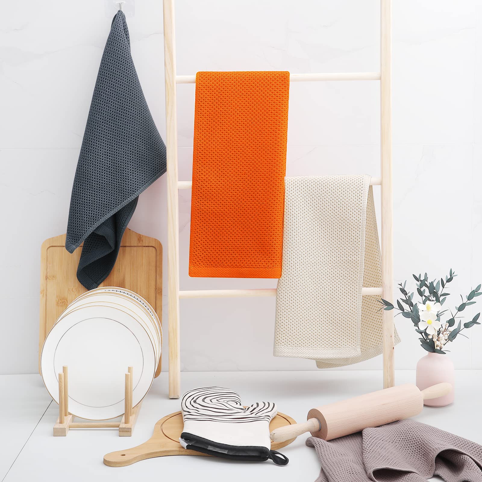 Orange Homaxy towels on a drying rack highlighting color and size
