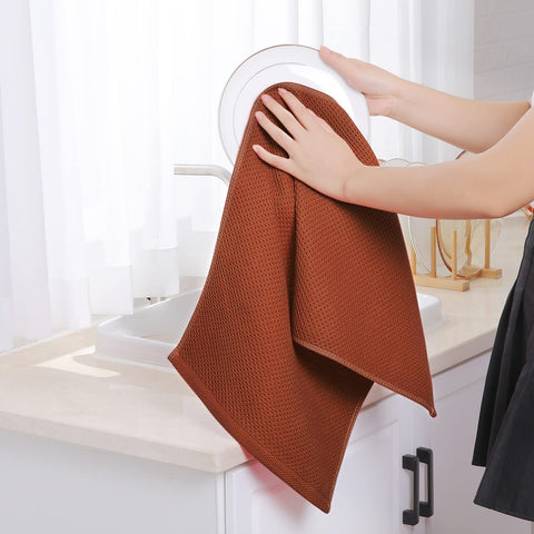 Homaxy rust-colored towels on kitchen counter matching decor and function