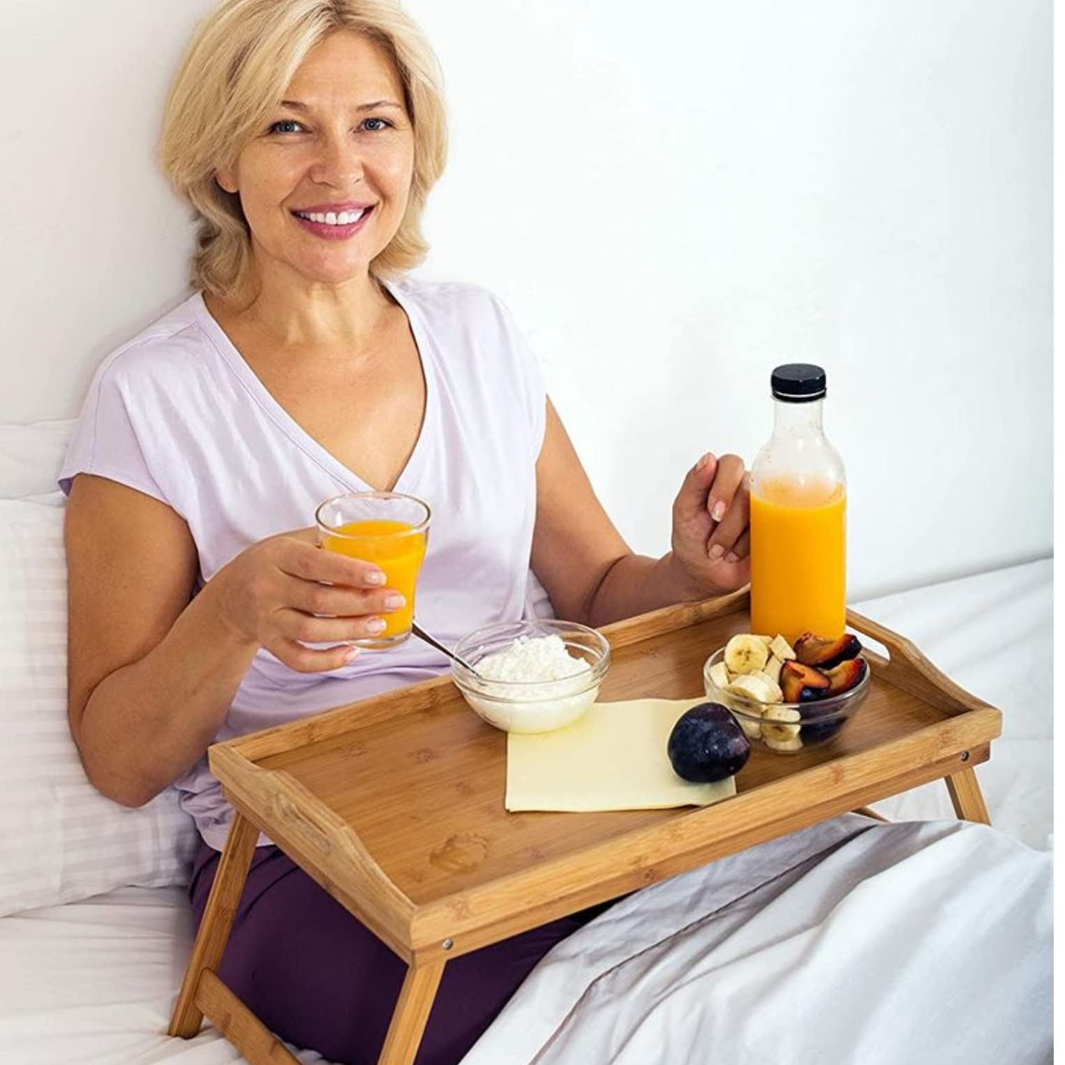 HOME IT sofa tray used for snacks during a movie on the couch.