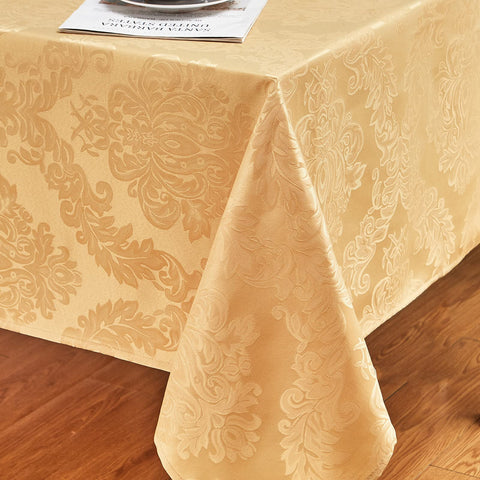 HomeJoy gold rectangle tablecloth on dining table during a meal with easy wipe-clean surface.