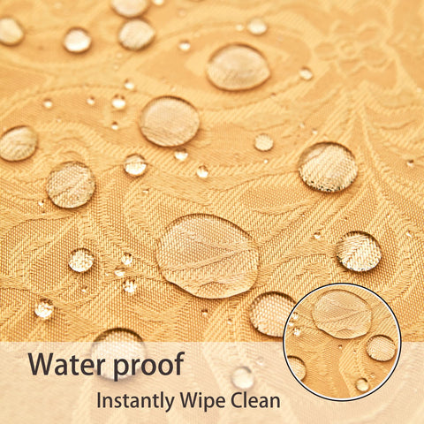 HomeJoy fabric being wiped clean with a damp cloth on a tablecloth.