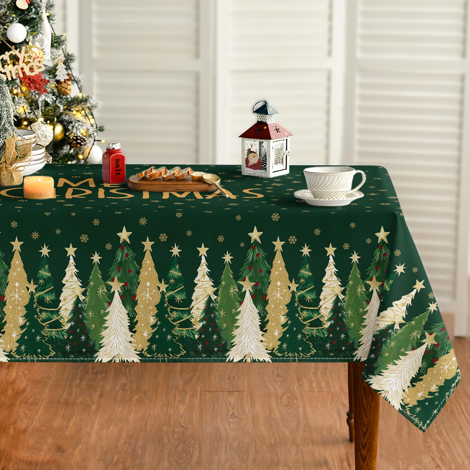 Horaldaily Christmas tablecloth with green stars and trees protects surfaces during celebrations.