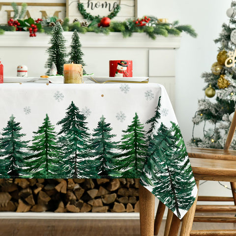 Horaldaily Christmas tablecloth on a dining table with colorful setting.
