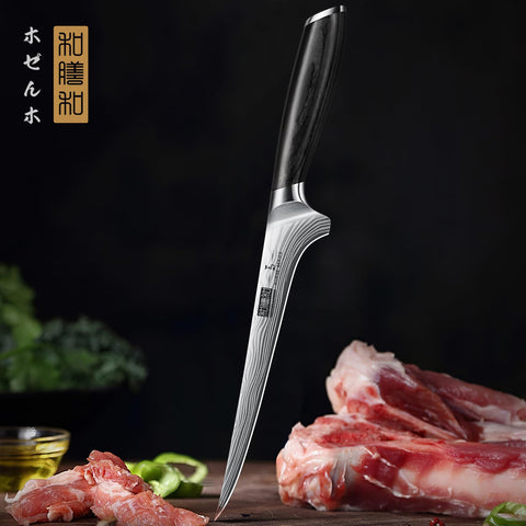 HOSHANHO boning knife in action for trimming skins and precise cuts.