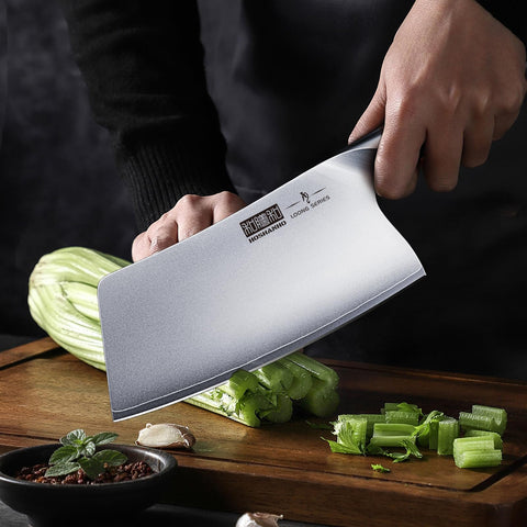 HOSHANHO Cleaver handling meat with clean, smooth surface for controlled cuts.