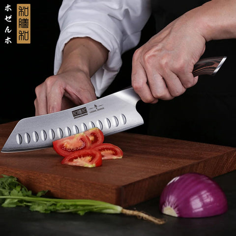 HOSHANHO knife slicing fruit and vegetables to demonstrate versatility