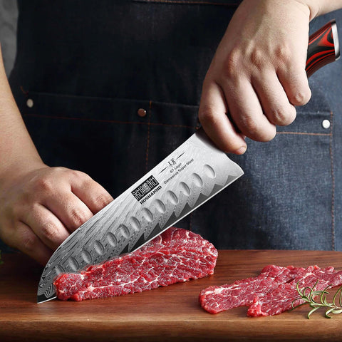HOSHANHO hollow-edge Santoku blade to reduce sticking.
