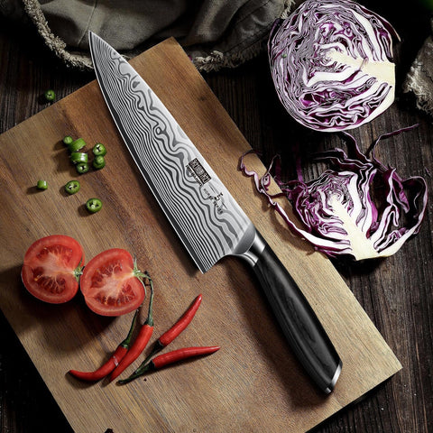 HOSHANHO chef knife slicing vegetables on a cutting board.