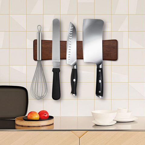 HOSHANHO multipurpose magnetic rack holds knives, utensils, and tools.