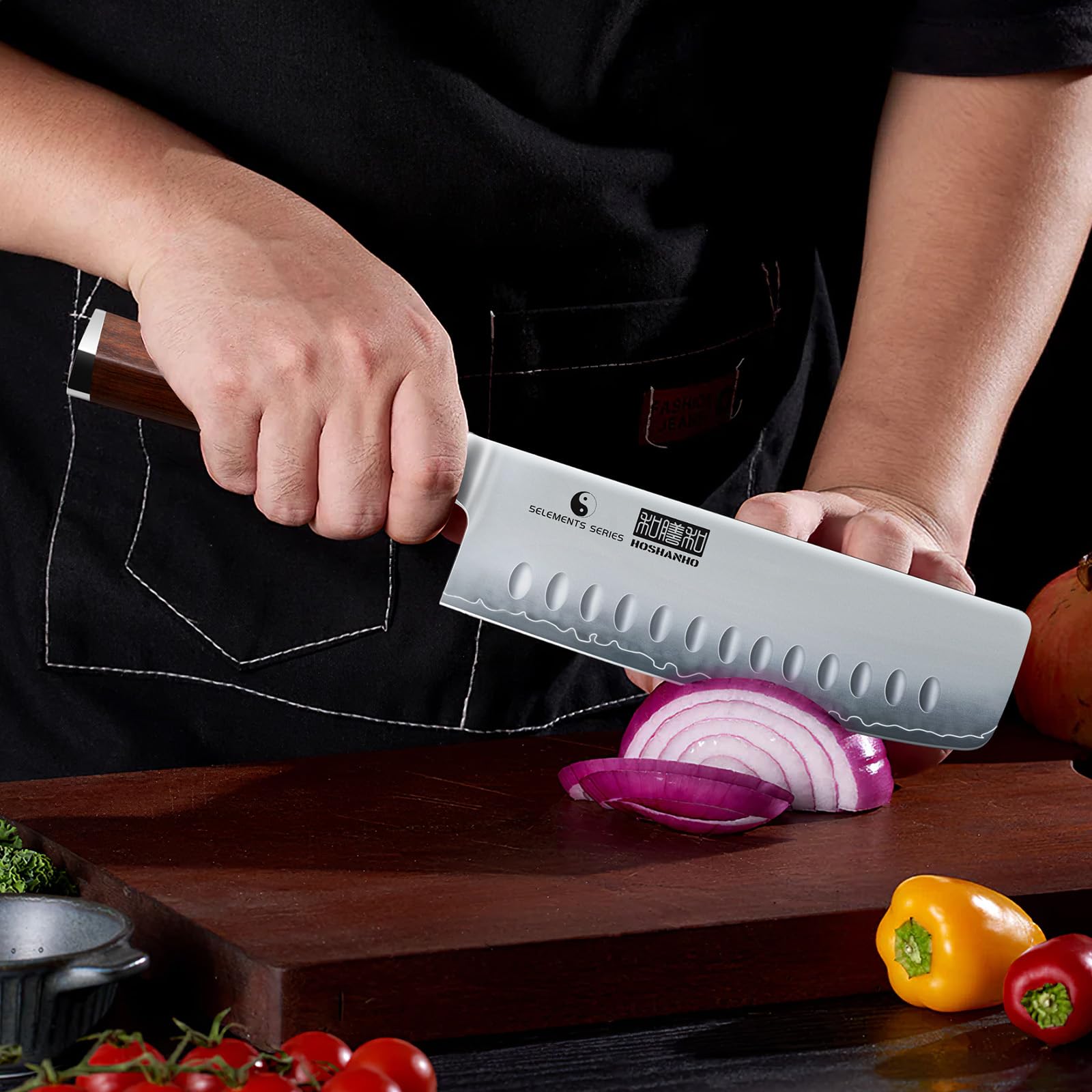 HOSHANHO Nakiri Knife slicing a tomato with precise, non-squash cuts.