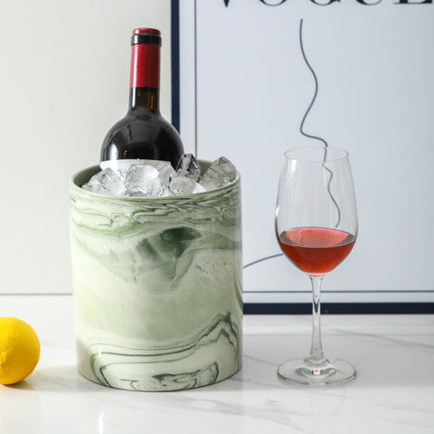 Howise marble green utensil holder on countertop keeps spatulas ready during cooking.