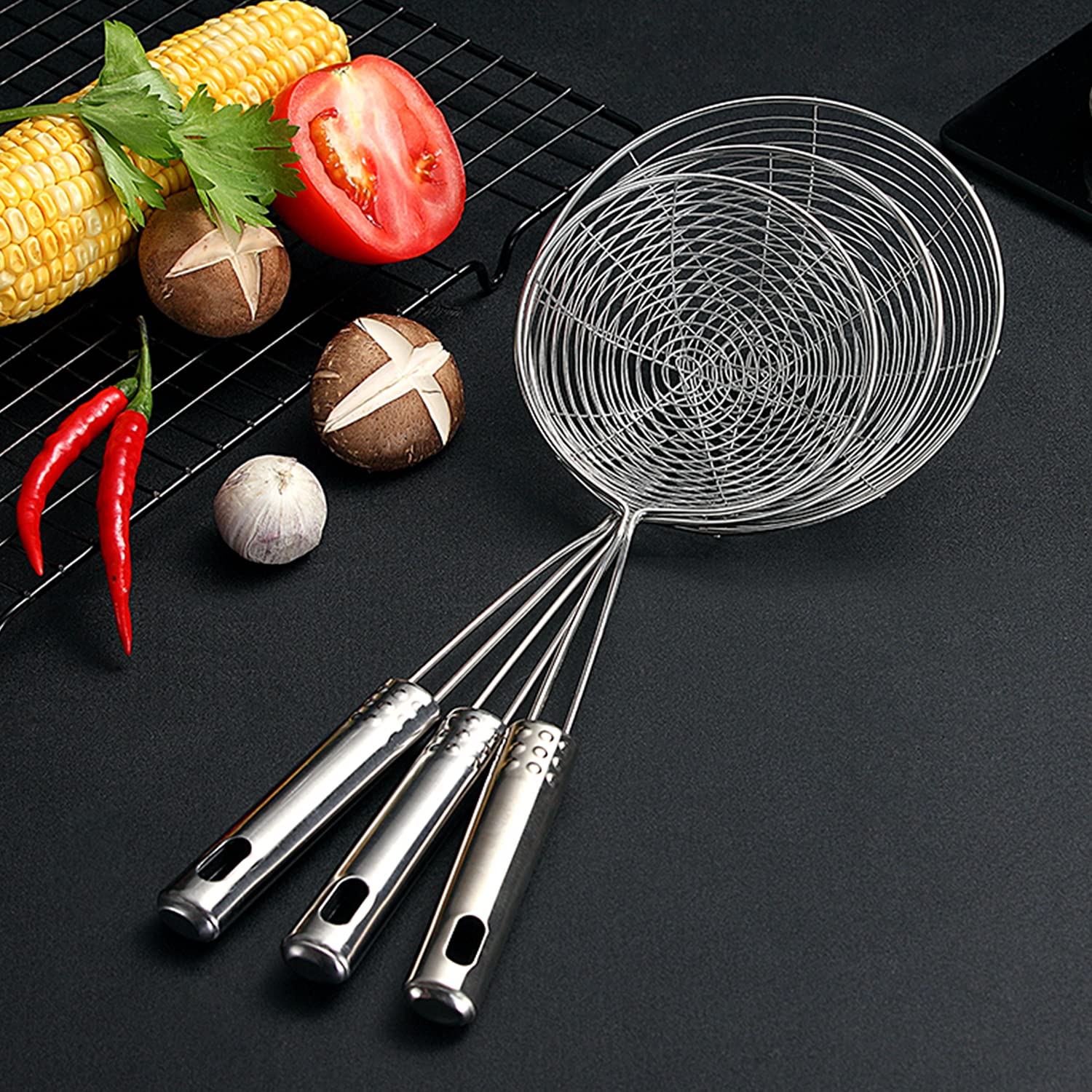 HSpiow spider strainer in action for frying and skimming in a fryer.
