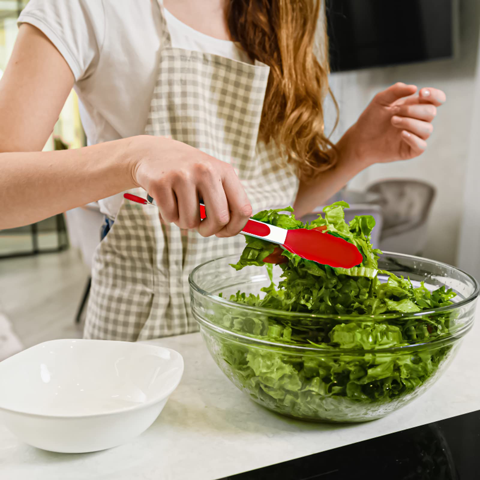 Red color adds a vibrant touch to kitchen tools