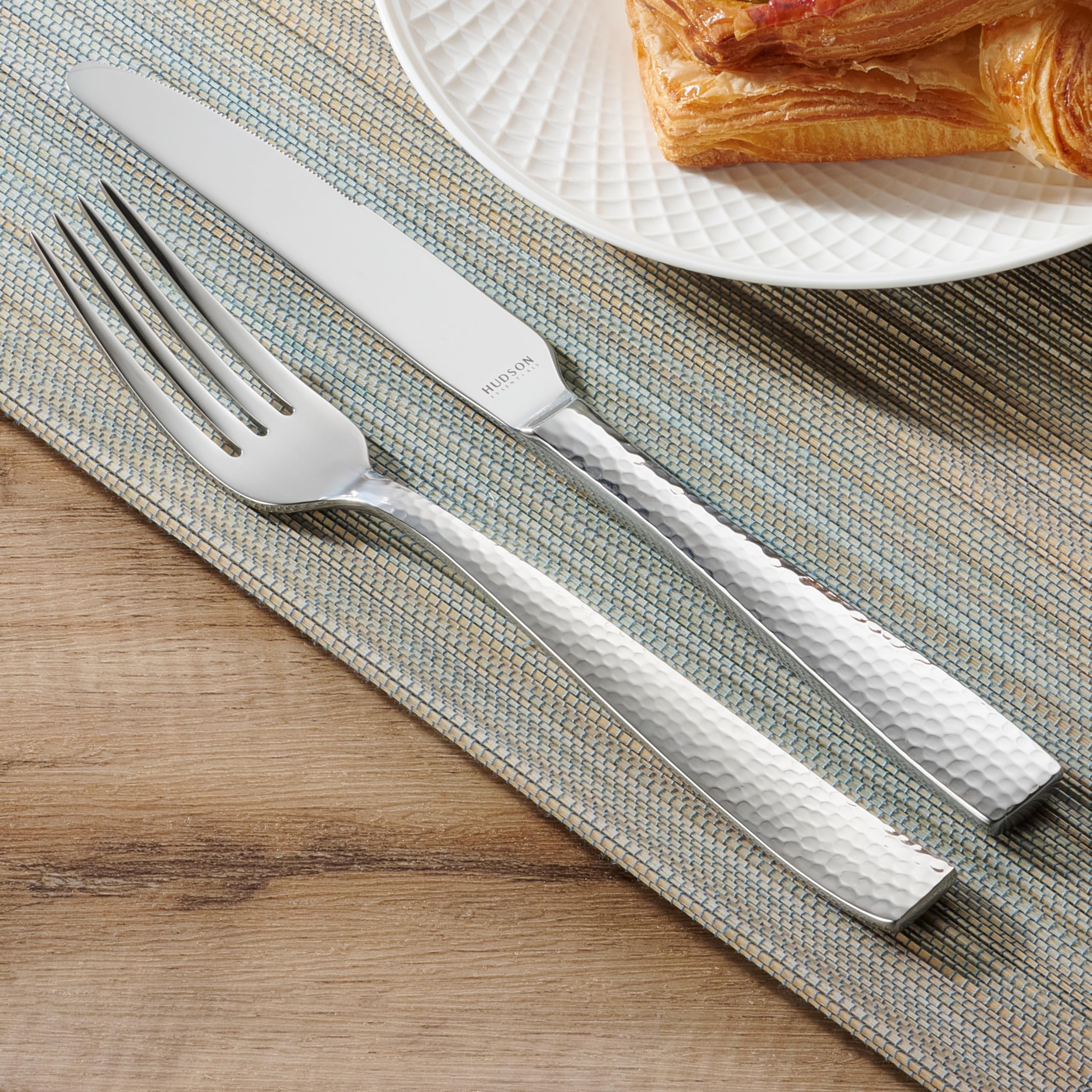 Hudson Essentials hammered flatware on table during dinner party for elegance