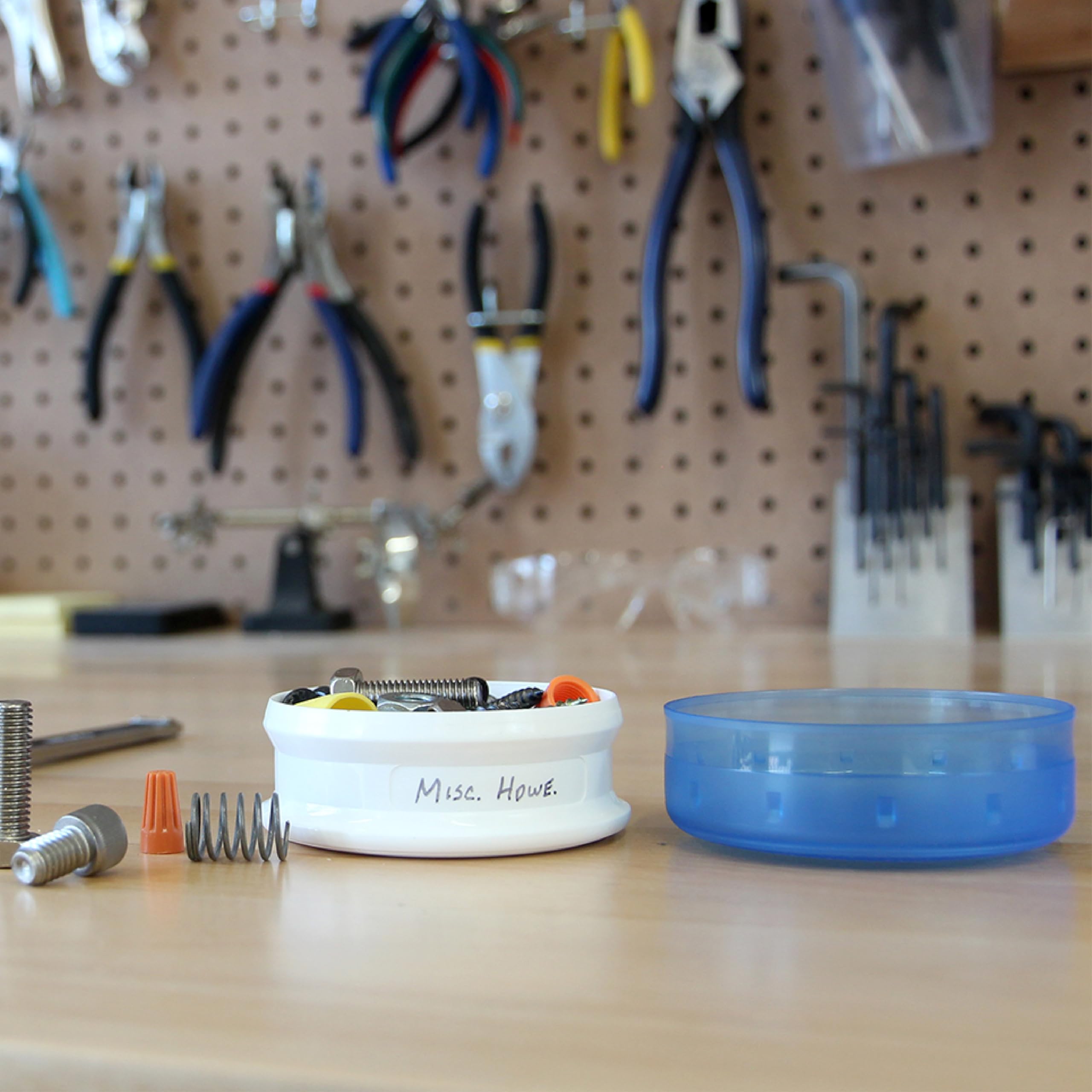 humangear GoTubb available in clear, green, and blue for quick content identification