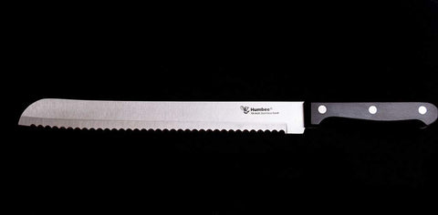 Humbee serrated edge closeup shows durable stainless steel and sharp performance.