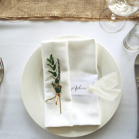 Humyoun wedding setup with ivory name cards and ribbons.