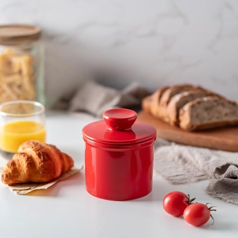 Husfunov butter keeper with water line enhances countertop decor.