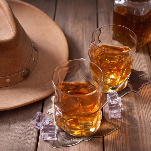 Hushee cowhide coaster on desk prevents spills and scratches