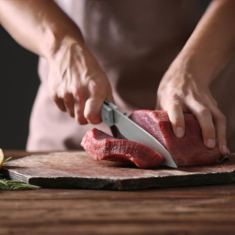 Huusk Folding Chef Knife blade open showing broad Santoku edge for efficient slicing