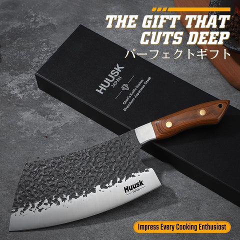 Huusk hand-forged knife with hammered pattern reduces sticking for cleaner cuts.