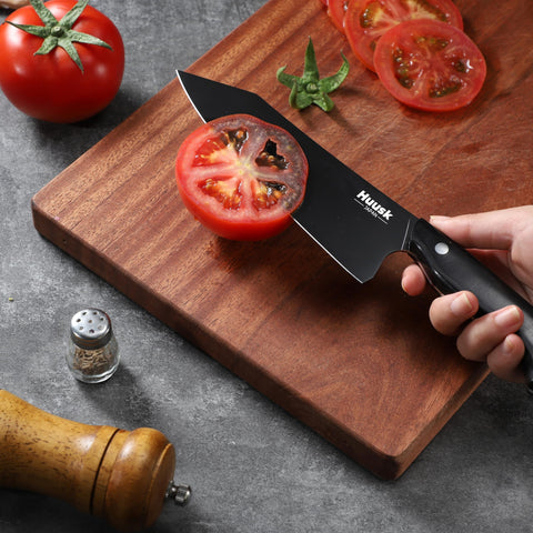 Huusk Kirisuke knife in daily kitchen use for versatile prep.