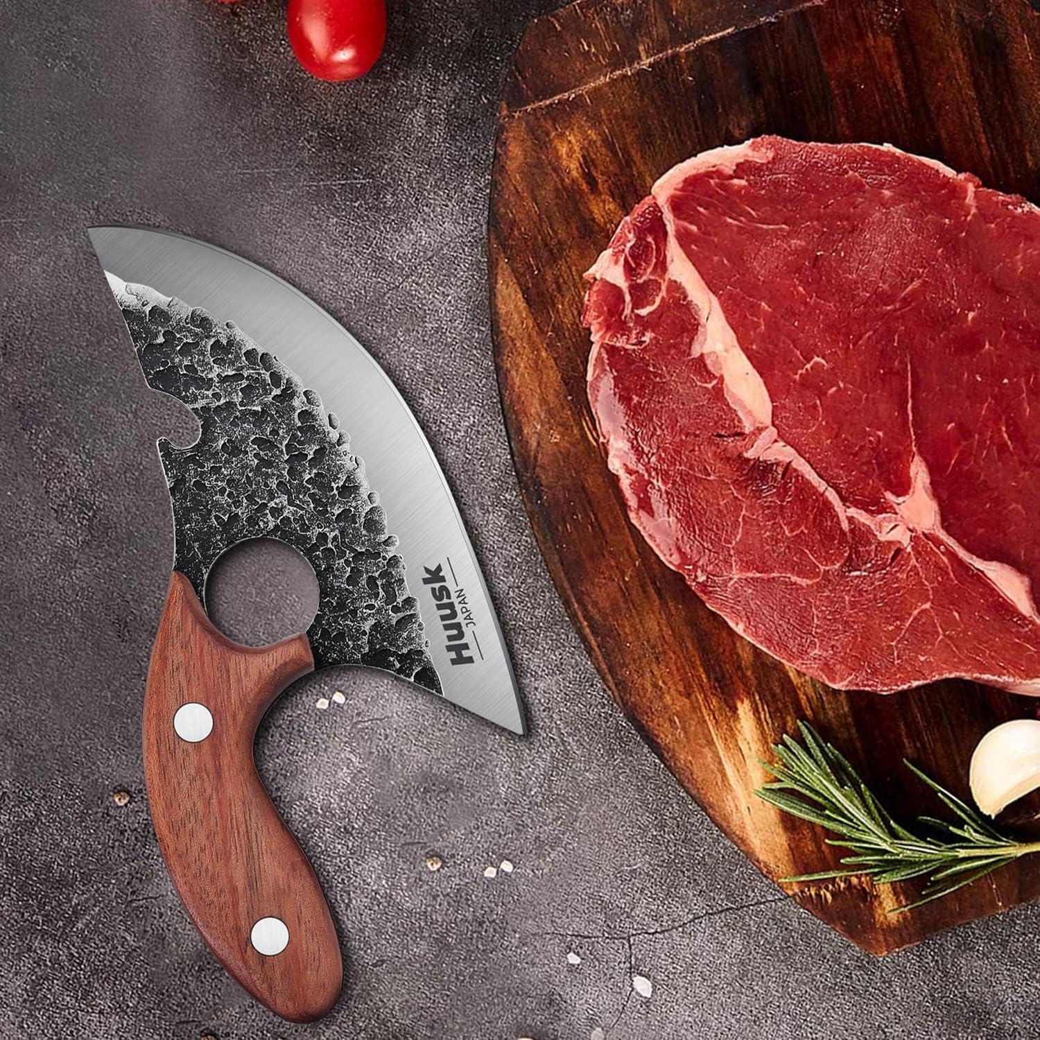 Huusk Ultimo knife shown in kitchen or camp scenarios.