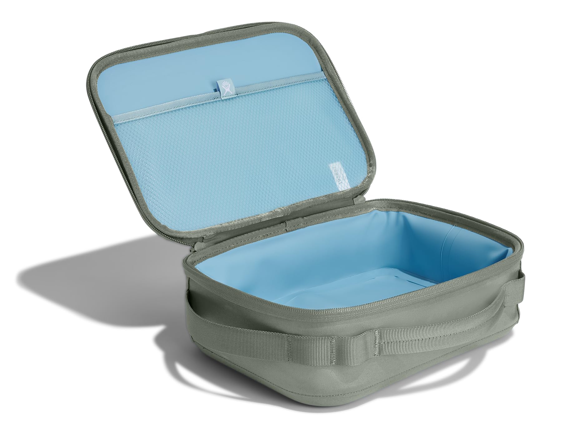 Hydro Flask lunch box open lid reveals roomy interior for sandwiches.