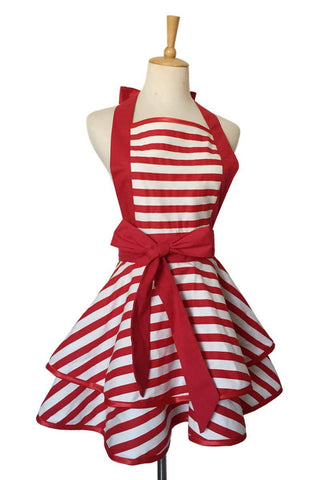 Hyzrz red apron in kitchen setting, ready for cooking tasks.