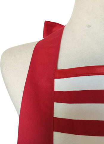 Hyzrz red party-ready apron during festive kitchen moment.