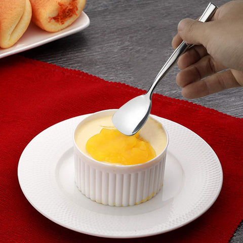 Idomy dessert spoons shown with coffee and tea usage in a cup
