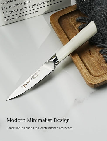 IGNITED CUTLERY paring knife with ivory handle, side view for secure grip.