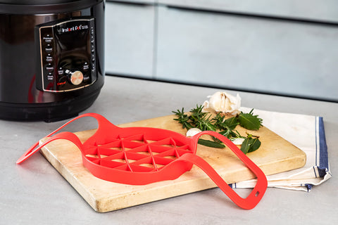 Instant Pot silicone sling roasts vegetables with even heat distribution.