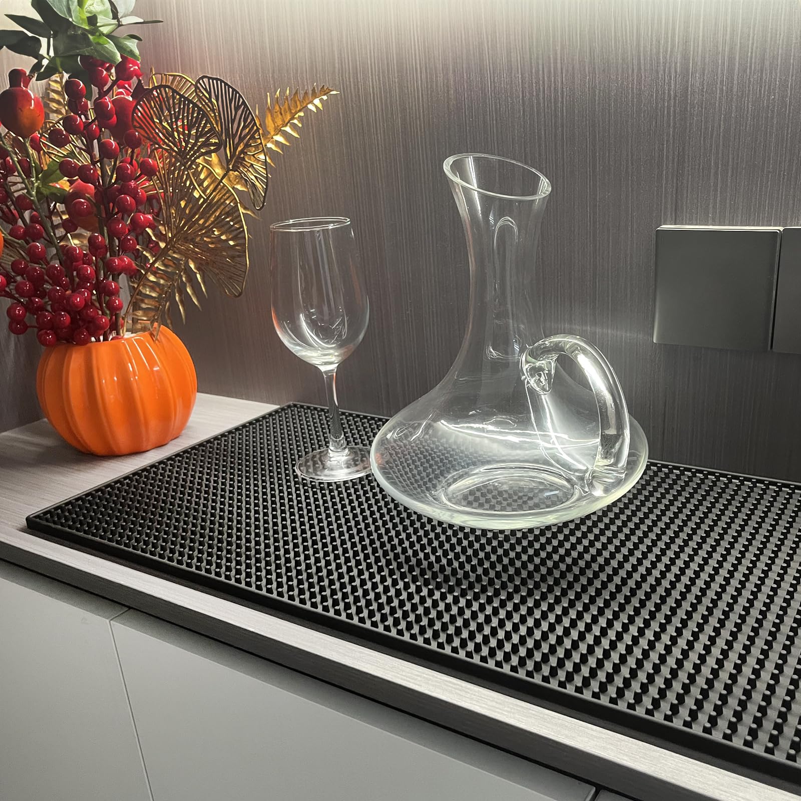 Invinton bar mat under coffee maker protects counters from spills.