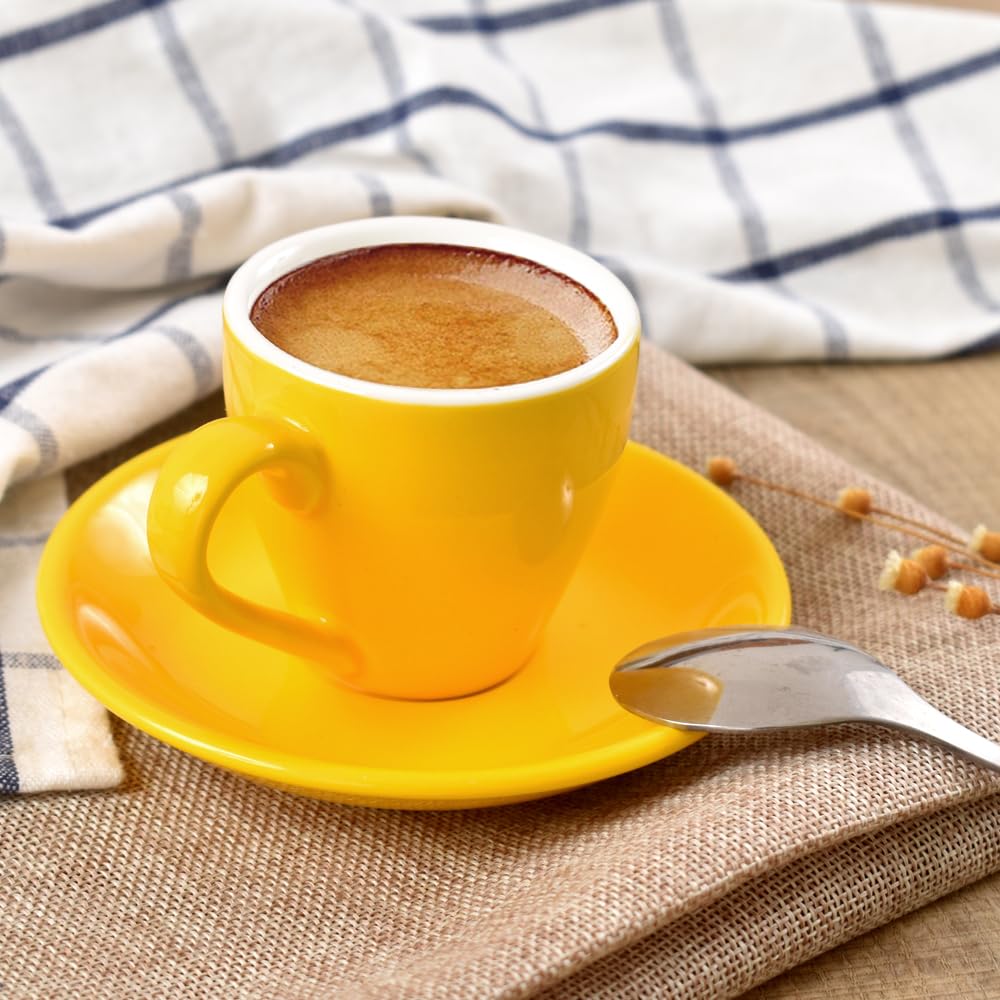 ionEgg yellow espresso cup and saucer on a desk brightening mornings