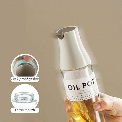 JANSSE glass oil bottle featuring stainless steel spout for durability.