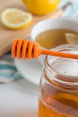 BPA-free Jarware lid with integrated dipper keeps honey stored safely.