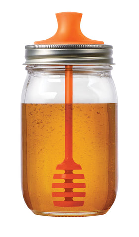 Jarware honey dipper lid in orange on a 16 oz regular-mouth jar for mess-free honey.