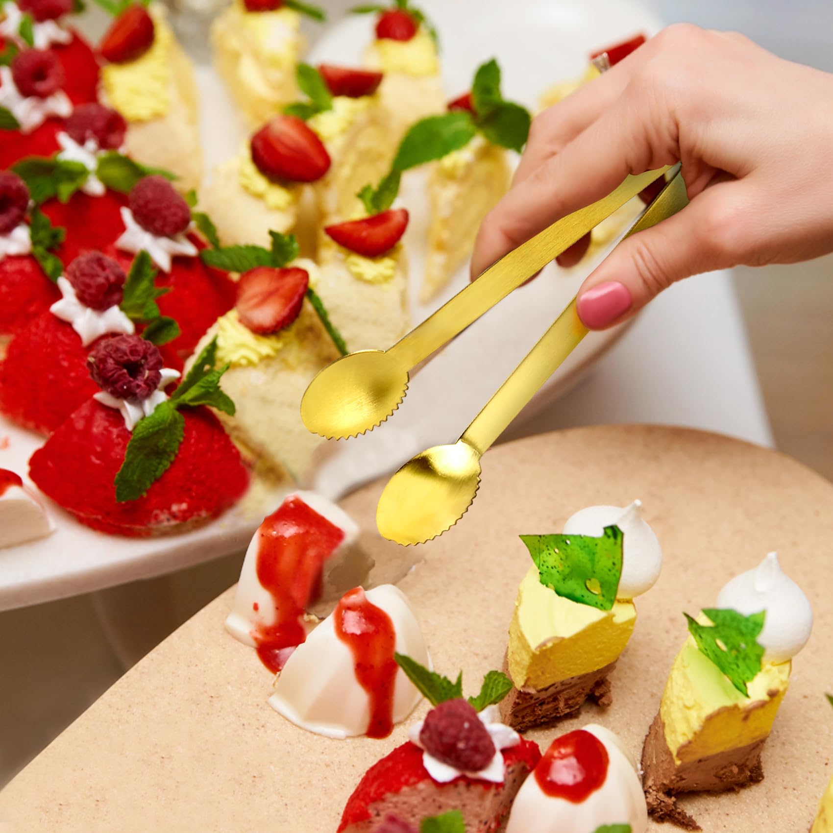 JCREN gold tongs at tea party, smooth edges protect delicate desserts.