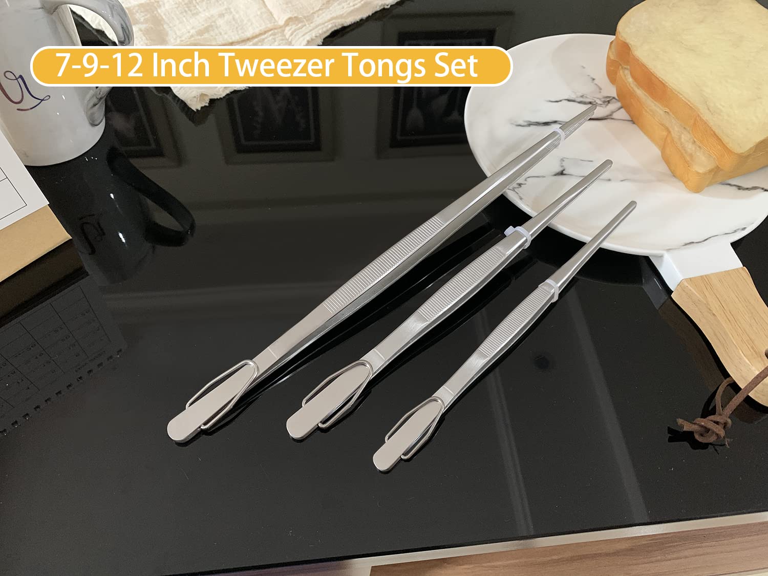 JETKONG food tweezers 9-inch serrated tips for lifting delicate bites.