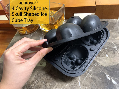 JETKONG skull mold being cleaned; dishwasher-safe and eco-friendly.