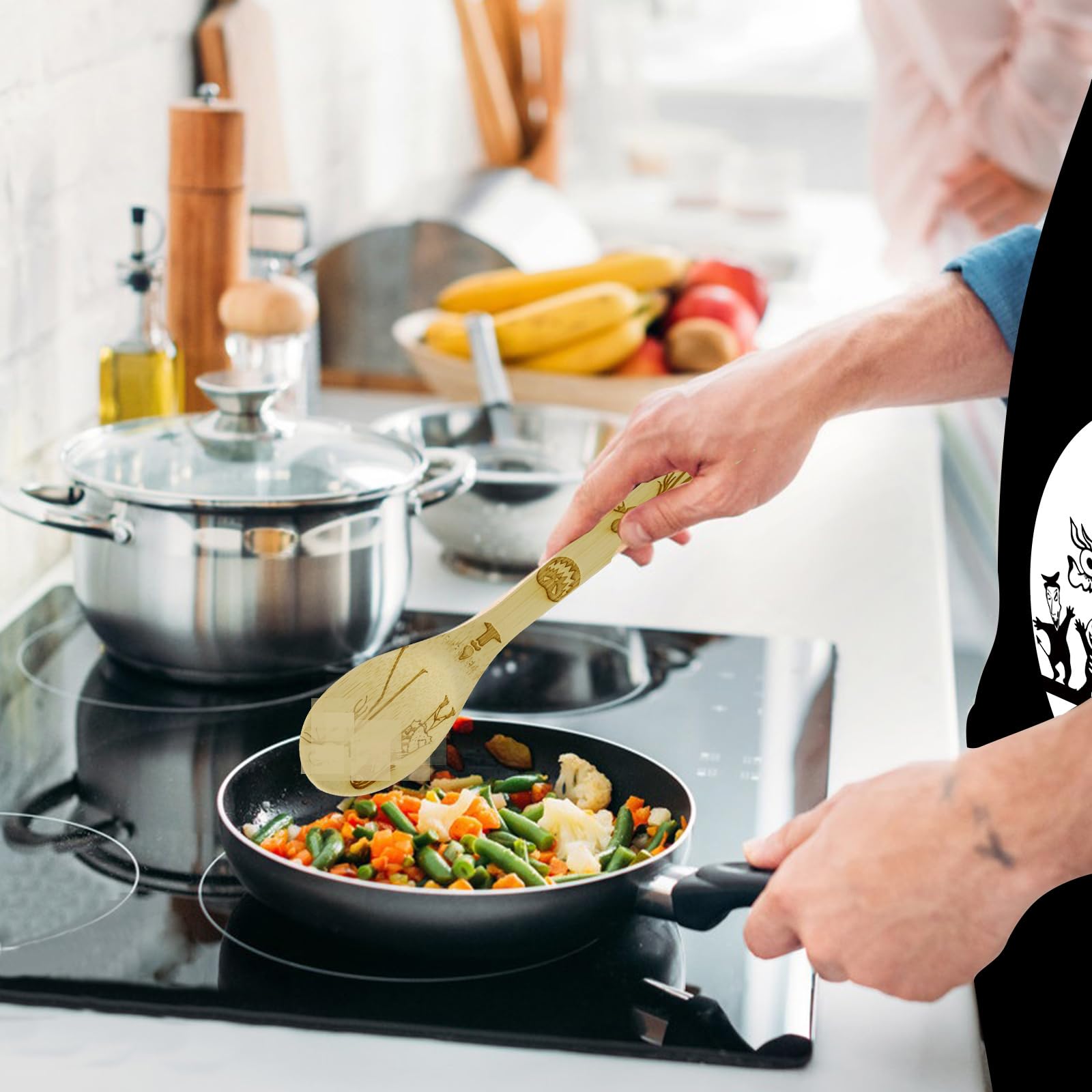 Jewelvwatchro apron with Nightmare design protecting clothes while cooking.