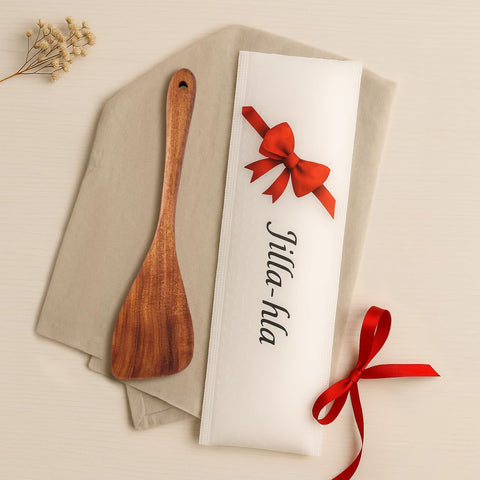 Jilla-hla spatula beside other cookware in a kitchen setup
