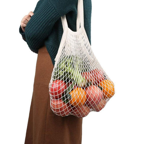 JM-capricorns orange mesh bag folded for easy carry.