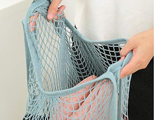 JM-capricorns beige mesh bag offering breathable storage for fruits and veggies.