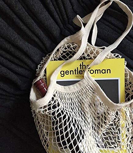JM-capricorns mesh bag in a market scene demonstrating versatile shopping use.